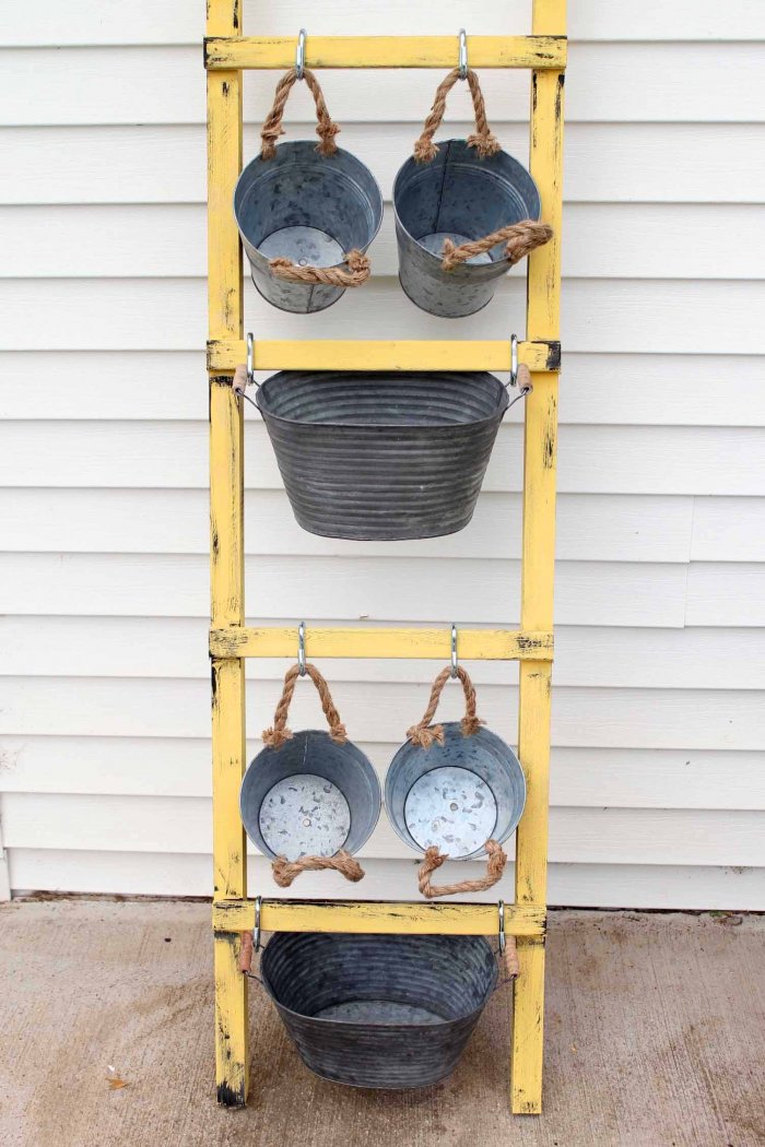 You can add more containers by using a taller ladder. (Photo courtesy of Angie Holden/The Country Chic Cottage)